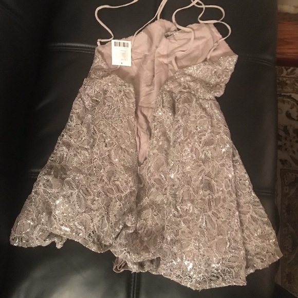 It’s a silver jumpsuit party dress 👗. - Picture 2 of 4